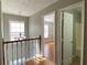 Upstairs hallway with access to bedrooms and bathroom at 1965 Tyler Trce, Lawrenceville, GA 30043