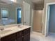 Bathroom with double vanity, shower, and bathtub at 1965 Tyler Trce, Lawrenceville, GA 30043