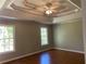 Bright bedroom featuring hardwood floors and multiple windows at 1965 Tyler Trce, Lawrenceville, GA 30043