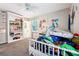 bedroom with built-in shelving and a ceiling fan at 386 Black Oak Ct, Lawrenceville, GA 30046