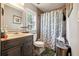Clean bathroom with a shower/tub combo and updated vanity at 386 Black Oak Ct, Lawrenceville, GA 30046