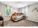 bedroom with crib, toys, and ample natural light at 386 Black Oak Ct, Lawrenceville, GA 30046