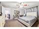 Bright bedroom with a queen-size bed and plenty of natural light at 386 Black Oak Ct, Lawrenceville, GA 30046