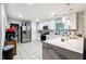 Modern kitchen with white cabinets and a large island at 386 Black Oak Ct, Lawrenceville, GA 30046