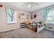 bedroom with carpet, ceiling fan, and two windows at 386 Black Oak Ct, Lawrenceville, GA 30046