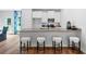 Modern kitchen with granite countertops, stainless steel appliances, and breakfast bar at 1916 School House Ln, Temple, GA 30179