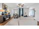 Bright living room featuring hardwood floors, comfy sectional sofa, and a modern fireplace at 1916 School House Ln, Temple, GA 30179
