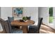 Charming dining room features a round wooden table with four chairs at 1916 School House Ln, Temple, GA 30179