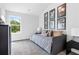 Cozy bedroom with a daybed, window, and framed art at 1916 School House Ln, Temple, GA 30179