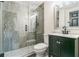 Modern bathroom with a dark vanity, glass shower, and gray tile at 3939 Perry Pass, Lithonia, GA 30038