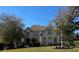 Brick two-story house with landscaped yard and large windows at 3939 Perry Pass, Lithonia, GA 30038
