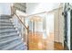 Elegant two-story entryway with hardwood floors and a grand staircase at 3939 Perry Pass, Lithonia, GA 30038