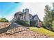 House exterior showcasing a stone retaining wall and deck at 3939 Perry Pass, Lithonia, GA 30038