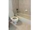 Simple bathroom with beige tile, a bathtub, and toilet at 3939 Perry Pass, Lithonia, GA 30038