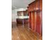Kitchen with hardwood floors, dark wood cabinets, and ample storage at 3939 Perry Pass, Lithonia, GA 30038