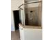 Large walk-in shower with neutral tile and glass enclosure at 3939 Perry Pass, Lithonia, GA 30038