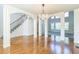 Bright dining room featuring hardwood floors and a crystal chandelier at 3939 Perry Pass, Lithonia, GA 30038