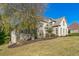 Brick house with a tree in the front yard and a large lawn at 3939 Perry Pass, Lithonia, GA 30038