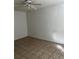 Simple bedroom with tile flooring and ceiling fan at 209 E Wilson St # 2, Villa Rica, GA 30180