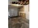 Unfinished garage with concrete floor and open door at 209 E Wilson St # 2, Villa Rica, GA 30180