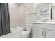 Simple bathroom with single vanity and bathtub shower combo at 402 Beacon Way, Villa Rica, GA 30180