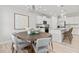 Dining area with a large table and kitchen view at 402 Beacon Way, Villa Rica, GA 30180