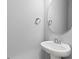 Small bathroom with pedestal sink and oval mirror at 402 Beacon Way, Villa Rica, GA 30180