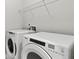 Laundry room with Whirlpool washer and dryer at 402 Beacon Way, Villa Rica, GA 30180