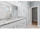 Bathroom with double vanity, granite countertop, and walk-in shower at 402 Beacon Way, Villa Rica, GA 30180