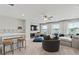 Bright bonus room with large sectional sofa and built-in shelving at 402 Beacon Way, Villa Rica, GA 30180