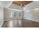 Spacious main bedroom with hardwood floors and tray ceiling at 295 Langshire Dr, Mcdonough, GA 30253