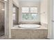 Bathroom with a large soaking tub at 2865 Payton Oaks Ne Dr, Atlanta, GA 30345