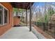Concrete patio below deck, next to wooded area at 2865 Payton Oaks Ne Dr, Atlanta, GA 30345