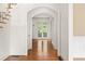 Elegant hallway with hardwood floors and arched doorways at 2865 Payton Oaks Ne Dr, Atlanta, GA 30345
