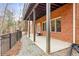 Covered patio with brick wall and wooded view at 2865 Payton Oaks Ne Dr, Atlanta, GA 30345