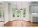 Bright eat-in kitchen nook with hardwood floors and view to backyard at 2865 Payton Oaks Ne Dr, Atlanta, GA 30345