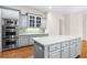 Kitchen with double oven, island, and hardwood floors at 2865 Payton Oaks Ne Dr, Atlanta, GA 30345