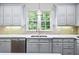 Kitchen with double sink, stainless steel appliances, and hardwood floors at 2865 Payton Oaks Ne Dr, Atlanta, GA 30345