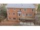 Brick home's rear elevation, showcasing a deck at 2865 Payton Oaks Ne Dr, Atlanta, GA 30345