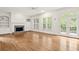 Bright Gathering room with hardwood floors, fireplace, and built-in shelving at 2865 Payton Oaks Ne Dr, Atlanta, GA 30345
