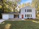 Two-story house with attached garage and landscaping at 125 Cainwood W Ct, Atlanta, GA 30349
