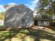 Gray sided house with landscaping and a grassy yard at 125 Cainwood W Ct, Atlanta, GA 30349