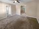 Open living room with neutral walls and carpet at 125 Cainwood W Ct, Atlanta, GA 30349