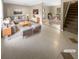 Virtually staged living room with tile floors and modern furniture at 125 Cainwood W Ct, Atlanta, GA 30349
