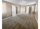 Spacious bedroom with neutral carpeting and ample closet space at 125 Cainwood W Ct, Atlanta, GA 30349