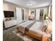 Virtually staged main bedroom with large bed and dresser at 125 Cainwood W Ct, Atlanta, GA 30349