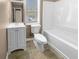 Clean bathroom with a white vanity, toilet, and bathtub at 125 Cainwood W Ct, Atlanta, GA 30349