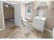 Bathroom with a toilet, vanity, and access to bedroom at 125 Cainwood W Ct, Atlanta, GA 30349