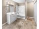 Clean bathroom, featuring a bathtub and white vanity at 125 Cainwood W Ct, Atlanta, GA 30349