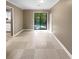 Dining room with tile flooring and sliding glass doors leading to the outdoors at 125 Cainwood W Ct, Atlanta, GA 30349